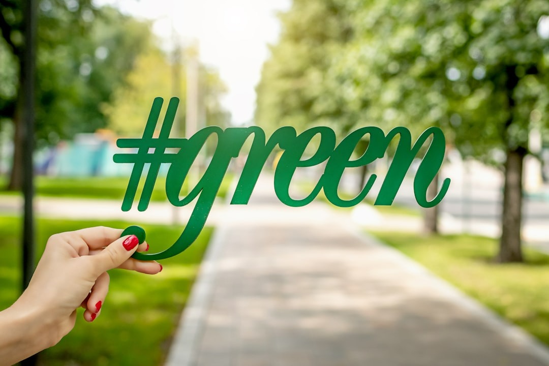 a person holding a #green cutout