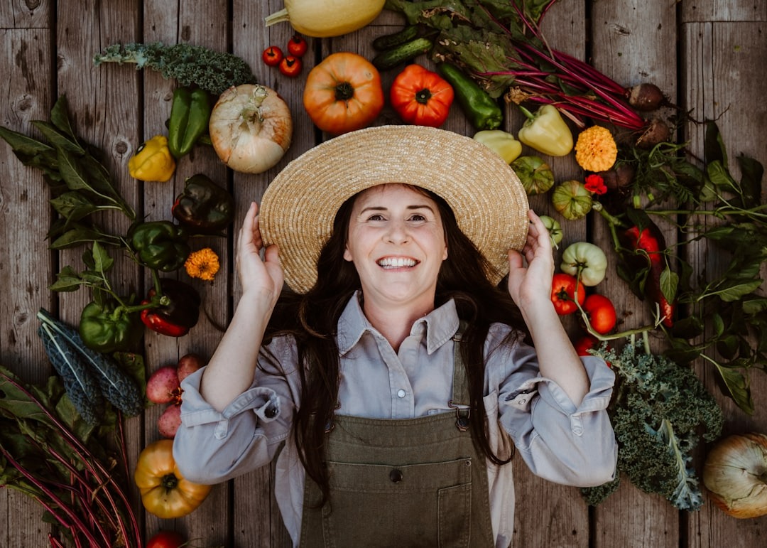 lady lying down surrounded with garden harvest